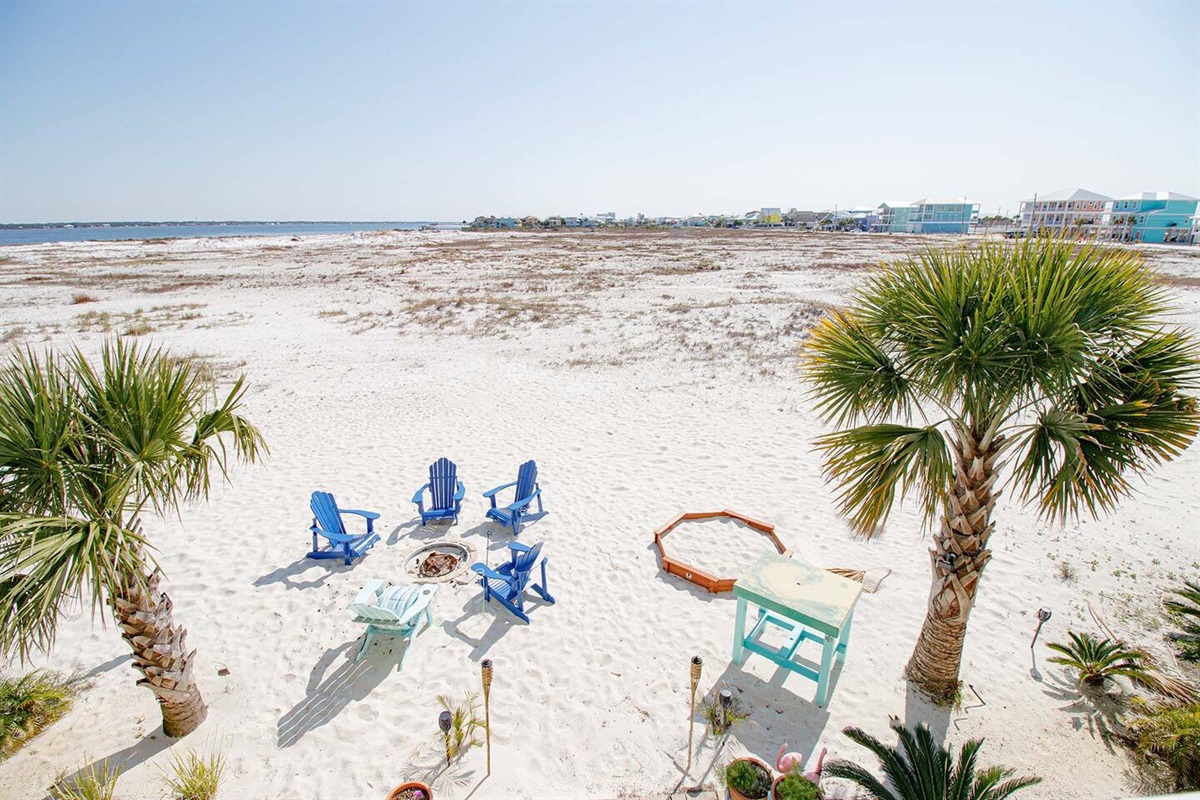 8 acres of stunning unobstructed Sound views. Dip your toes in the sand while gathering around the fire pit.