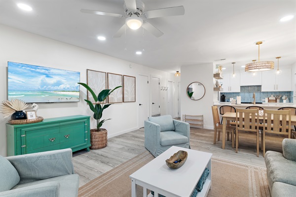 Welcoming Living Room: Step into comfort with our spacious living room, featuring plush seating and modern décor, perfect for relaxation after a sunny day at the beach.
