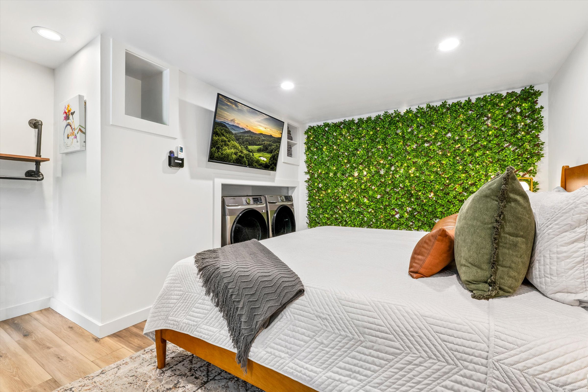Master Bedroom with King Bed, 42-inch Smart TV, sound machine, blackout curtains and desk with computer monitor.   Full size washer/dryer with detergent provided.