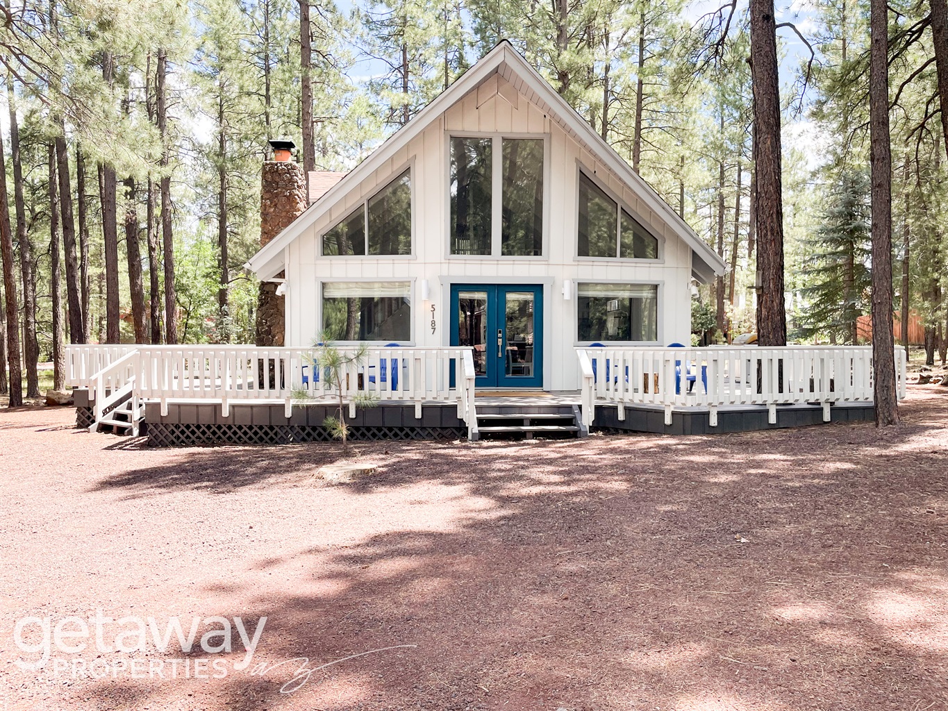 Your cozy Pinetop Lakes chalet with wraparound porch — perfect for all-season relaxation.
