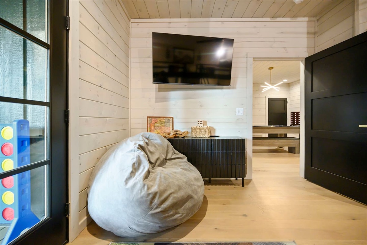 Bunk room also has a 55" TV and a bean bag chair that converts into a bed.