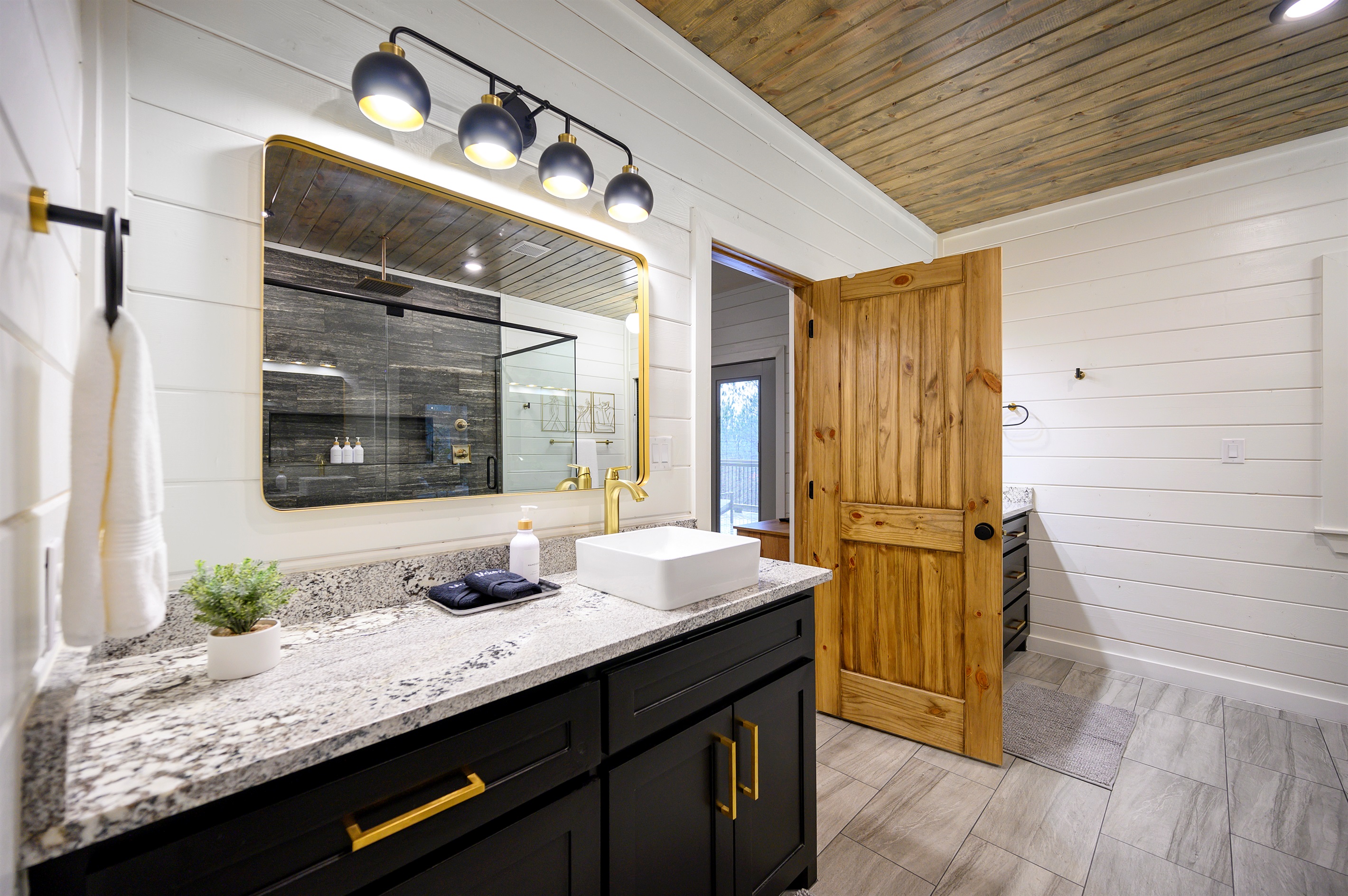 A complete bathroom setup featuring both tub and shower, providing flexibility and convenience throughout your stay