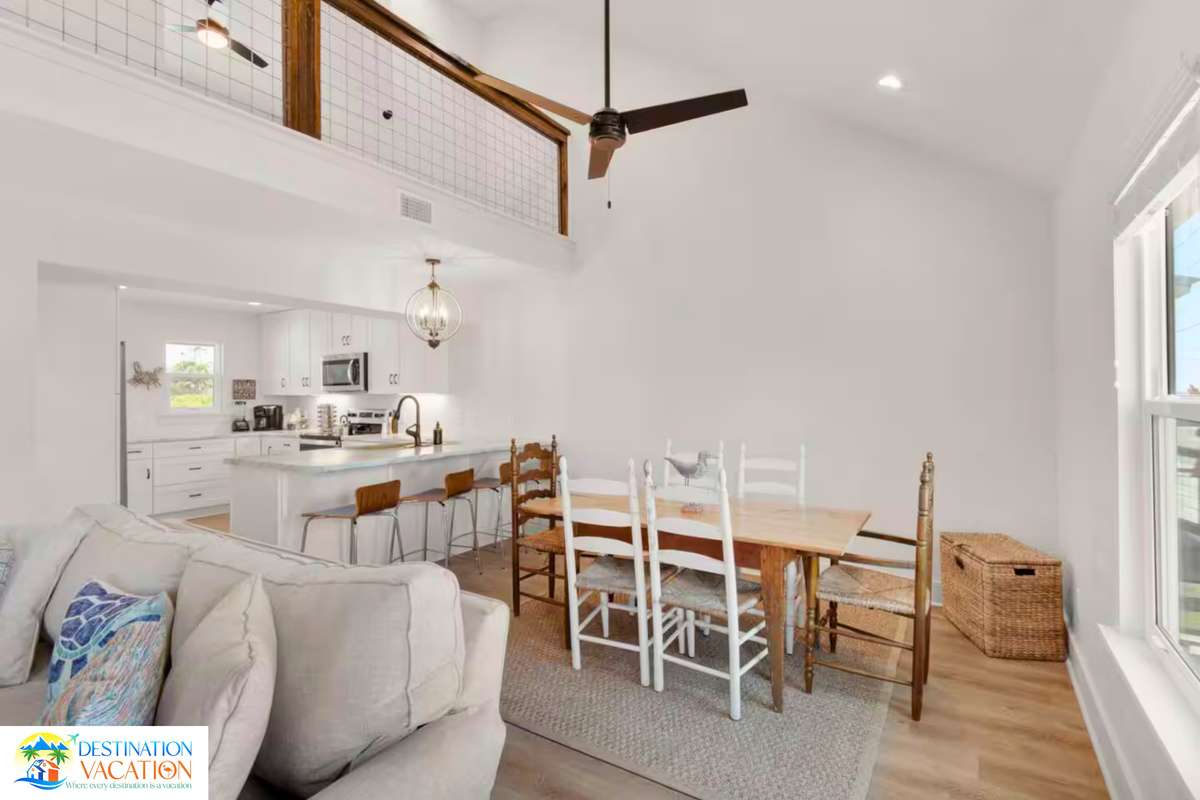 Dining and living flow beautifully beneath soaring ceilings.