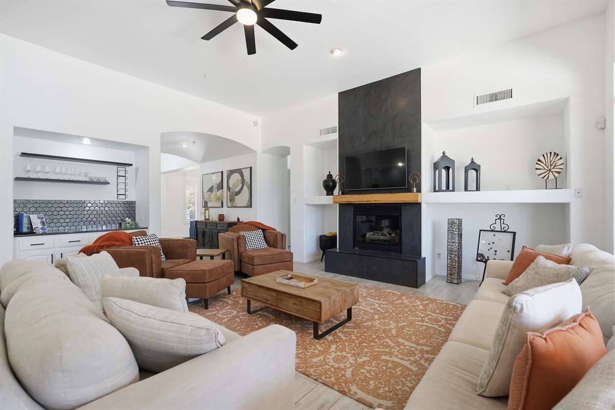 Living area with a wet bar.