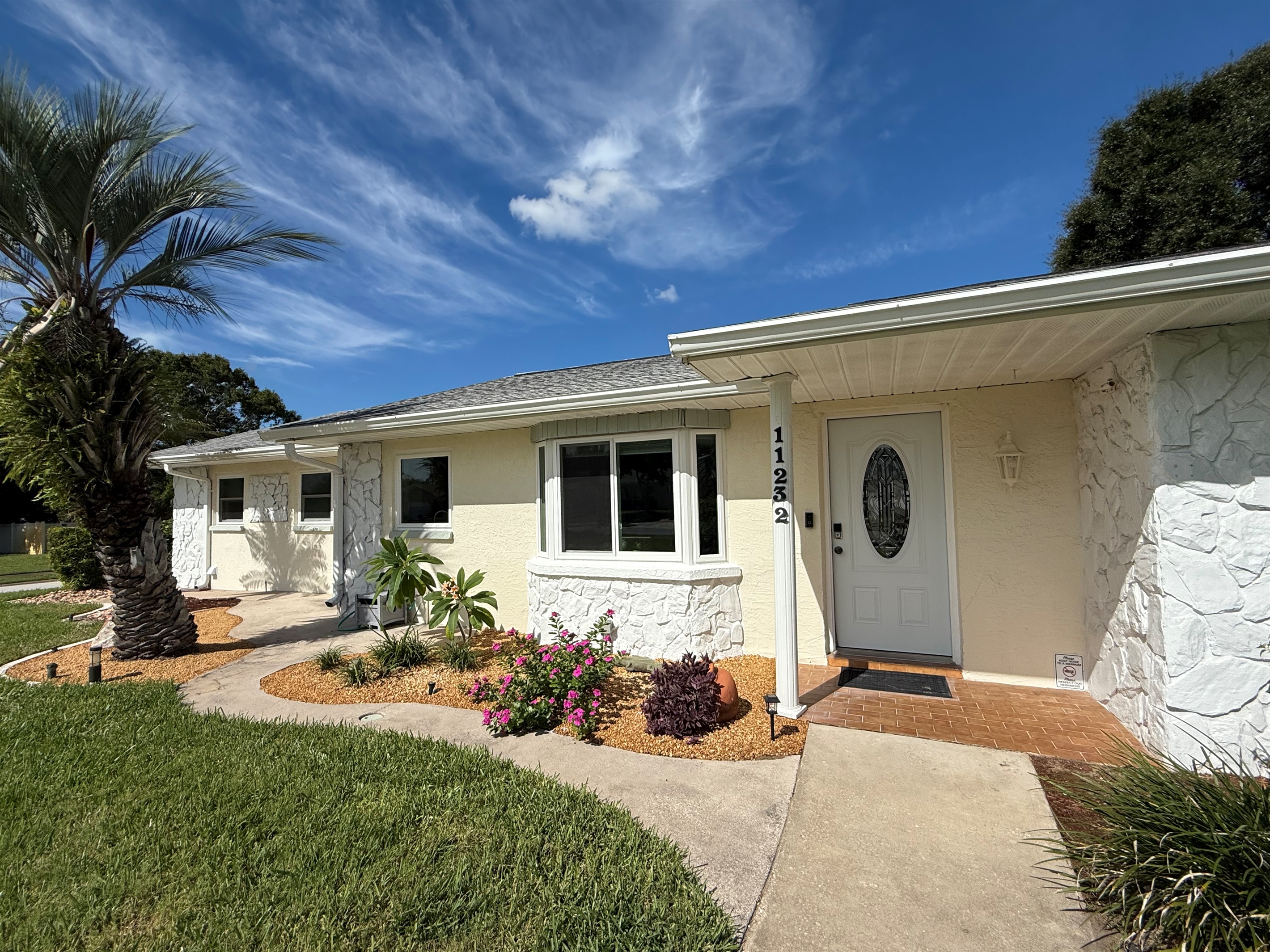 Corner lot. Landscaped and lavish front yard. The house is set back from the street for peace and privacy.