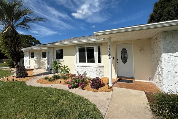 Corner lot. Landscaped and lavish front yard. The house is set back from the street for peace and privacy.