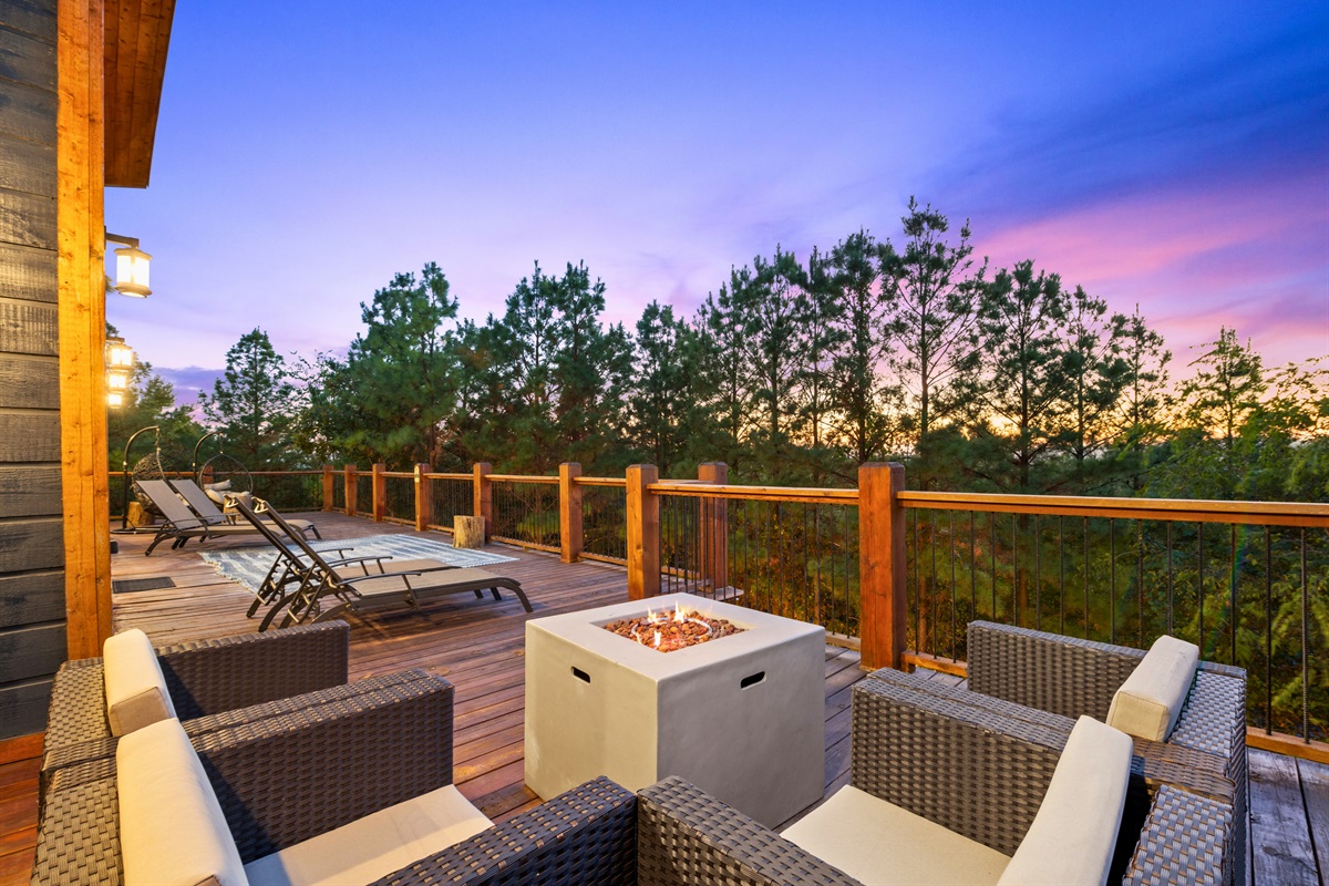 This elevated deck offers stunning views and a great place to relax, dine, or simply take in the beautiful surroundings.