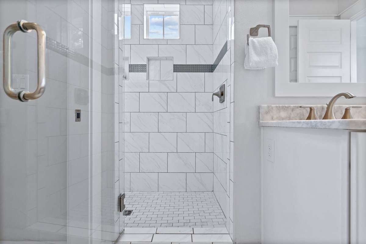 Walk-in shower with subway tile.