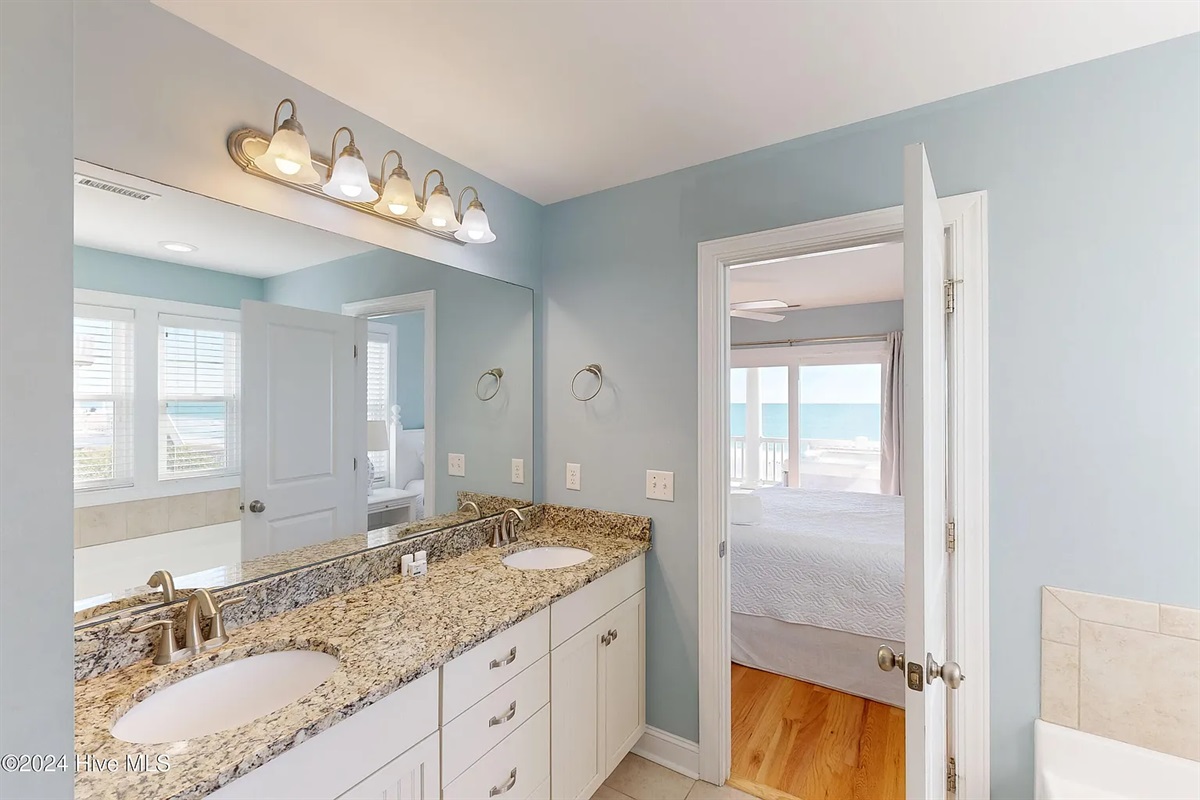 Large dual vanity bathroom with ample space to get ready