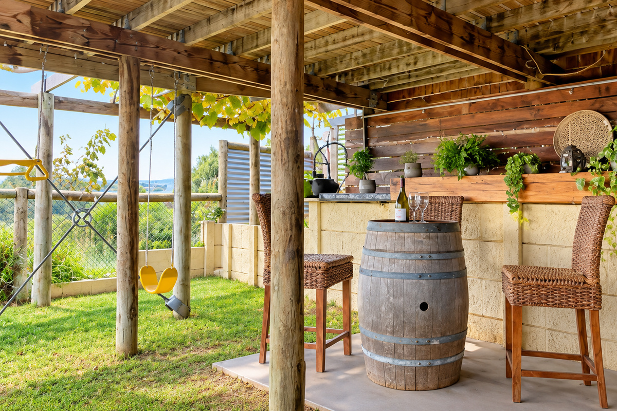 A unique outdoor entertaining space with bar seating, leafy touches and a relaxed retreat feel.