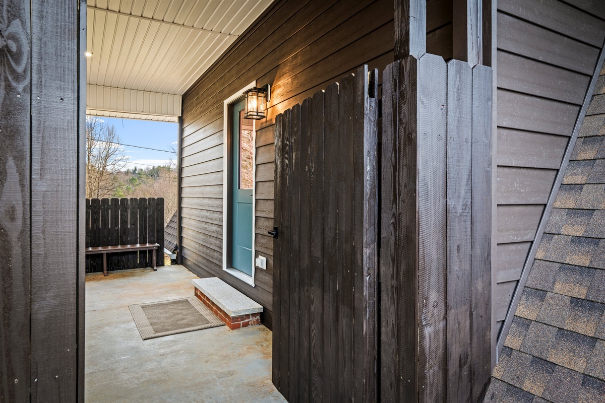 Nestled beneath the covered patio, the entrance to the retreat feels private and inviting. It’s a charming first glimpse of the cozy, upscale experience inside.

