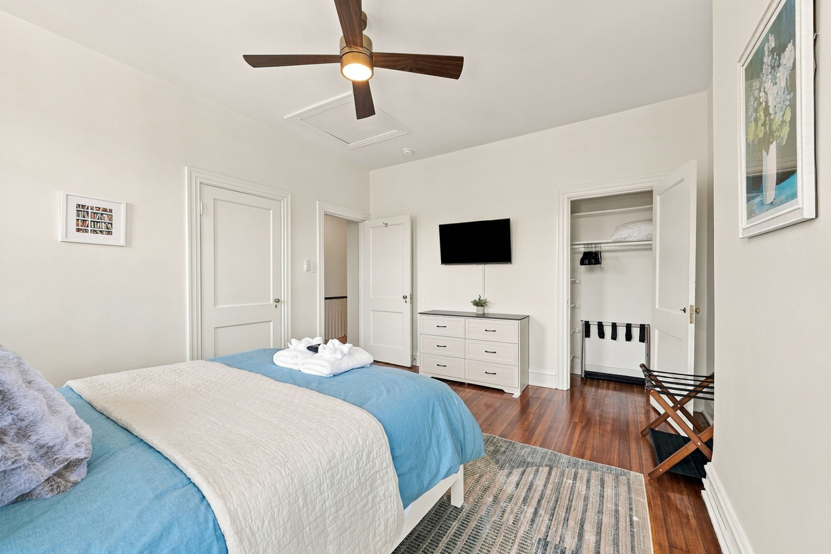 Serene Escape: Bright bedroom with stylish decor, large windows, and inviting views!