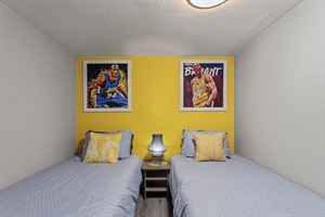 Your Twin Oasis – Unwind in our inviting bedroom, featuring two single beds