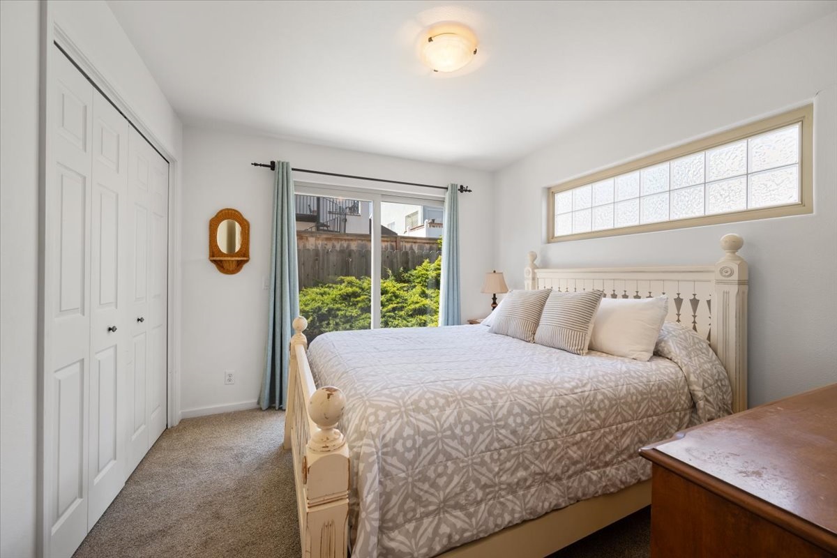 Queen bedroom with access to back patio