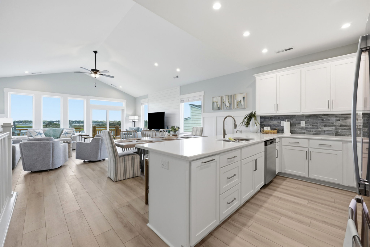 Whether you're cooking or catching up, this inviting kitchen is at the heart of the home