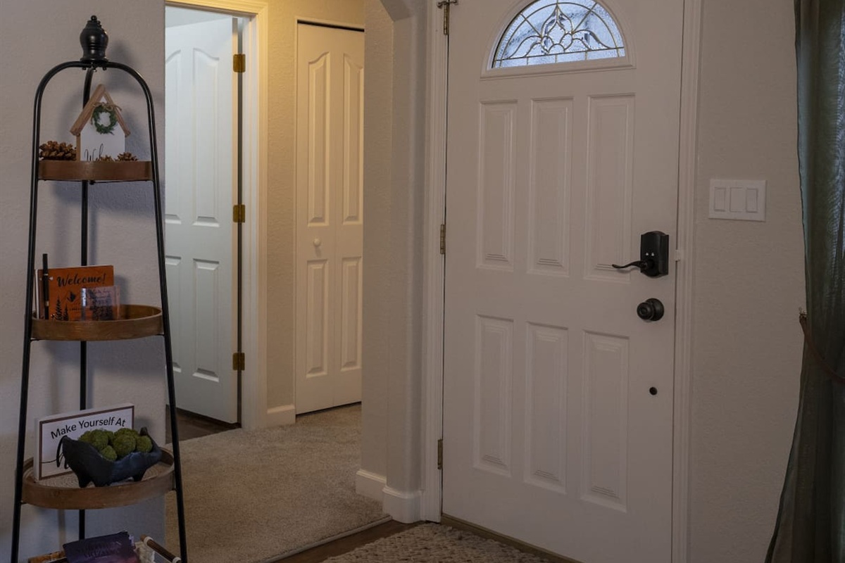 Hallway view showing the bedroom access from entry way