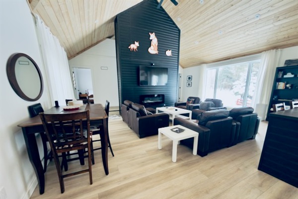 Spacious great room with dining table and cozy living room seating