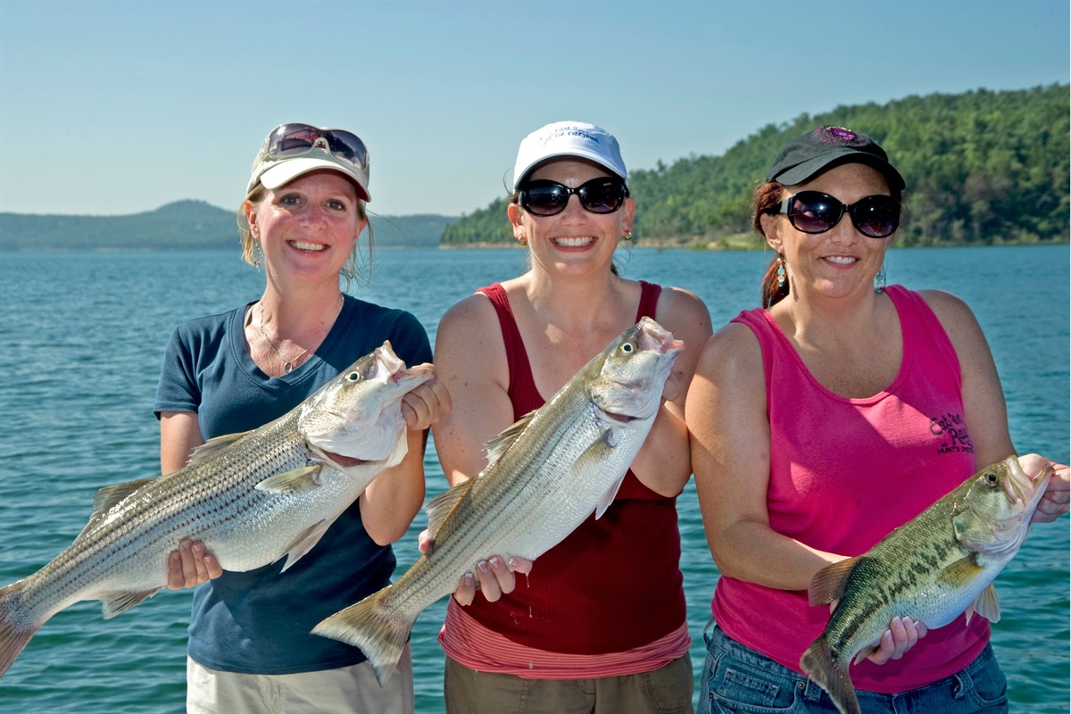 Girls trip on Beaver Lake, anyone? Spend the day on the water, reel in striped bass, and make unforgettable memories with your best friends in Rogers, Arkansas.