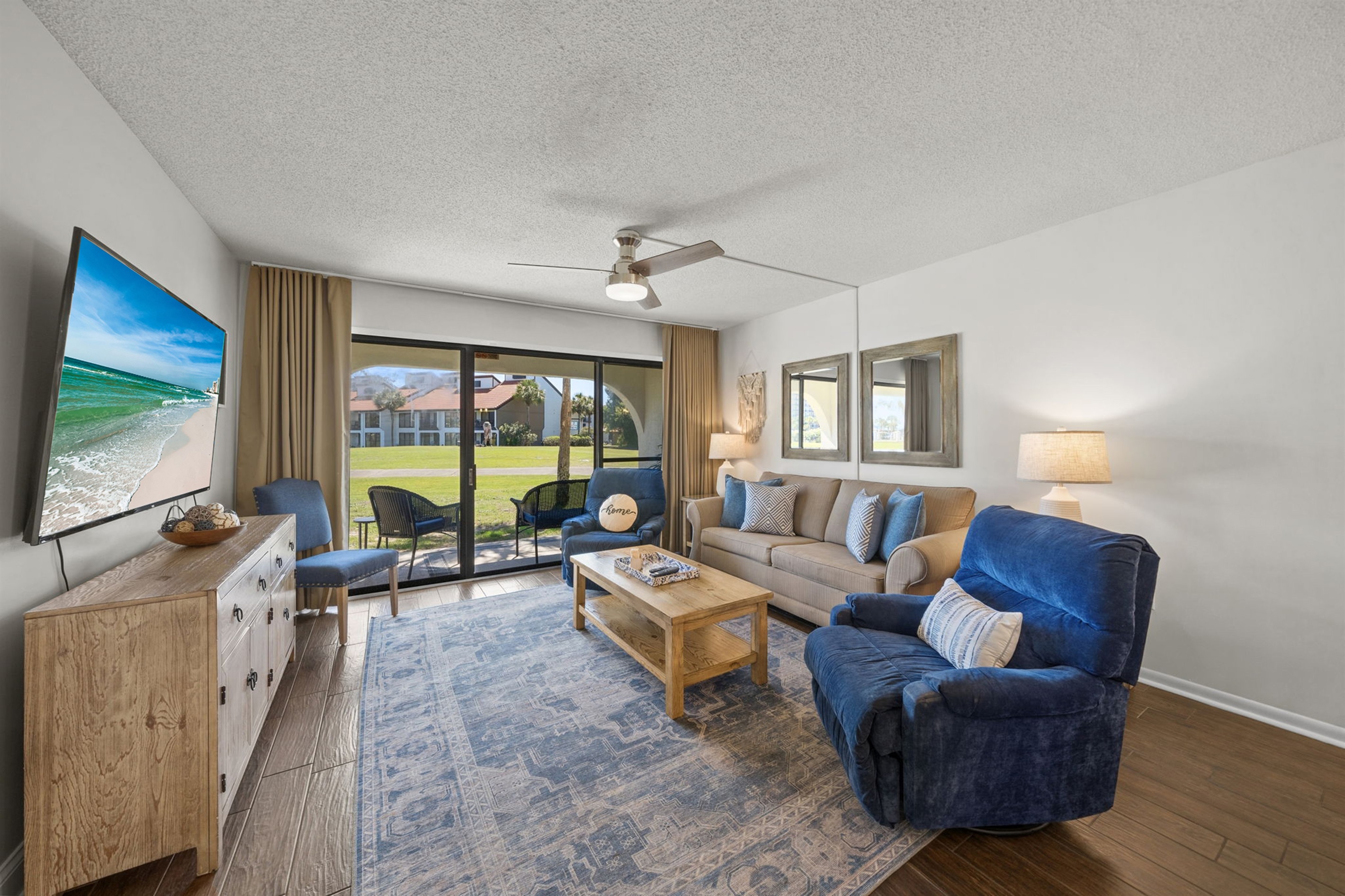 Relaxing living room area with 2 comfy recliners to kick back and relax after a day in the sun