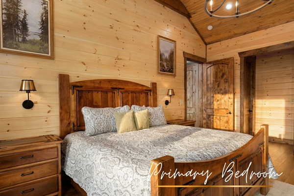 Drift off to sleep in this upstairs master bedroom, complete with a king bed and serene mountain views.