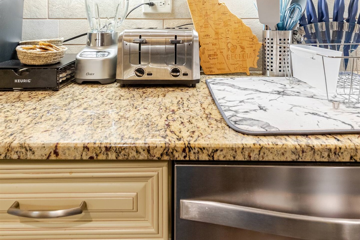 Sleek kitchen w/ modern cabinets & ample counter space for easy meals.