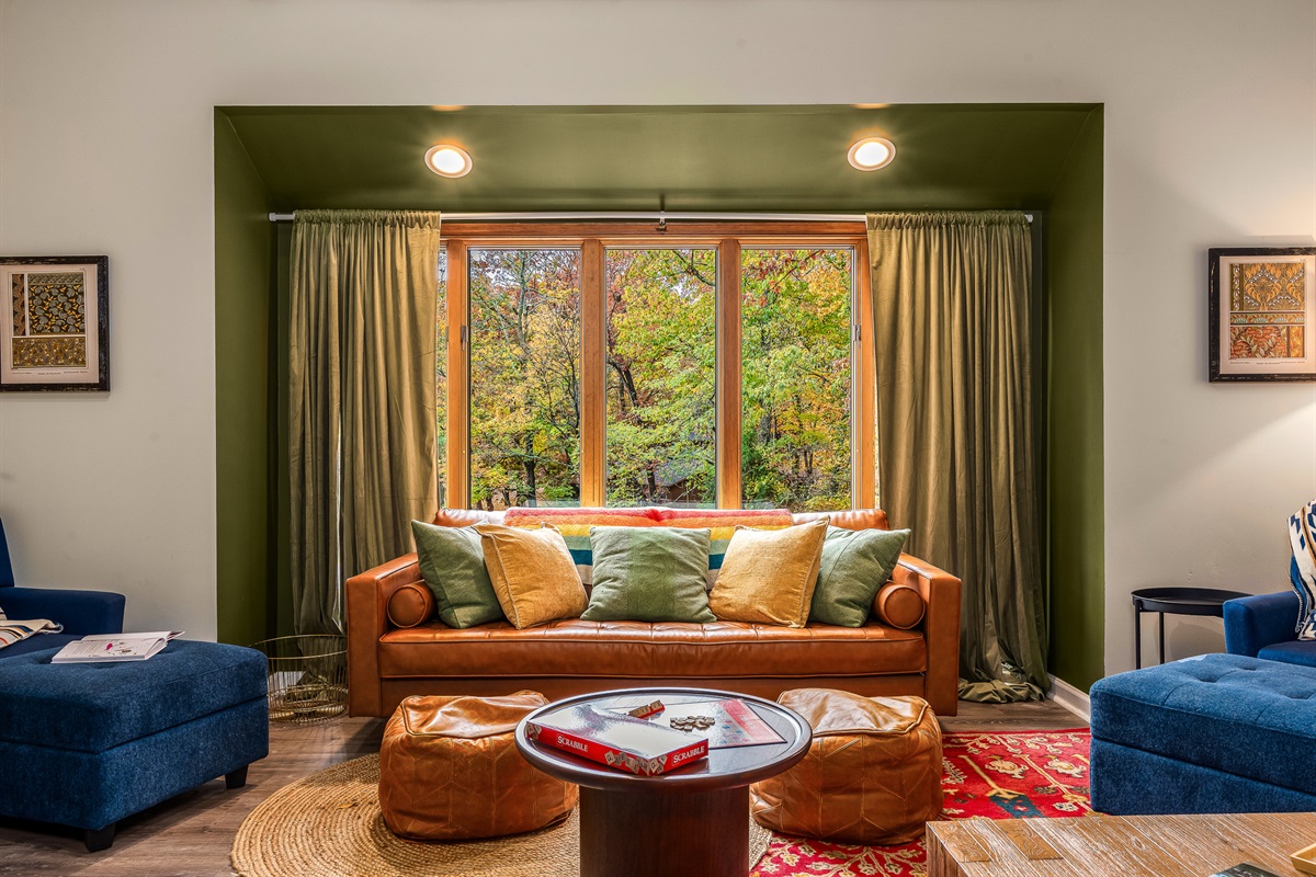 Curl up with a blanket and watch the colors of the forest shift right outside your window.