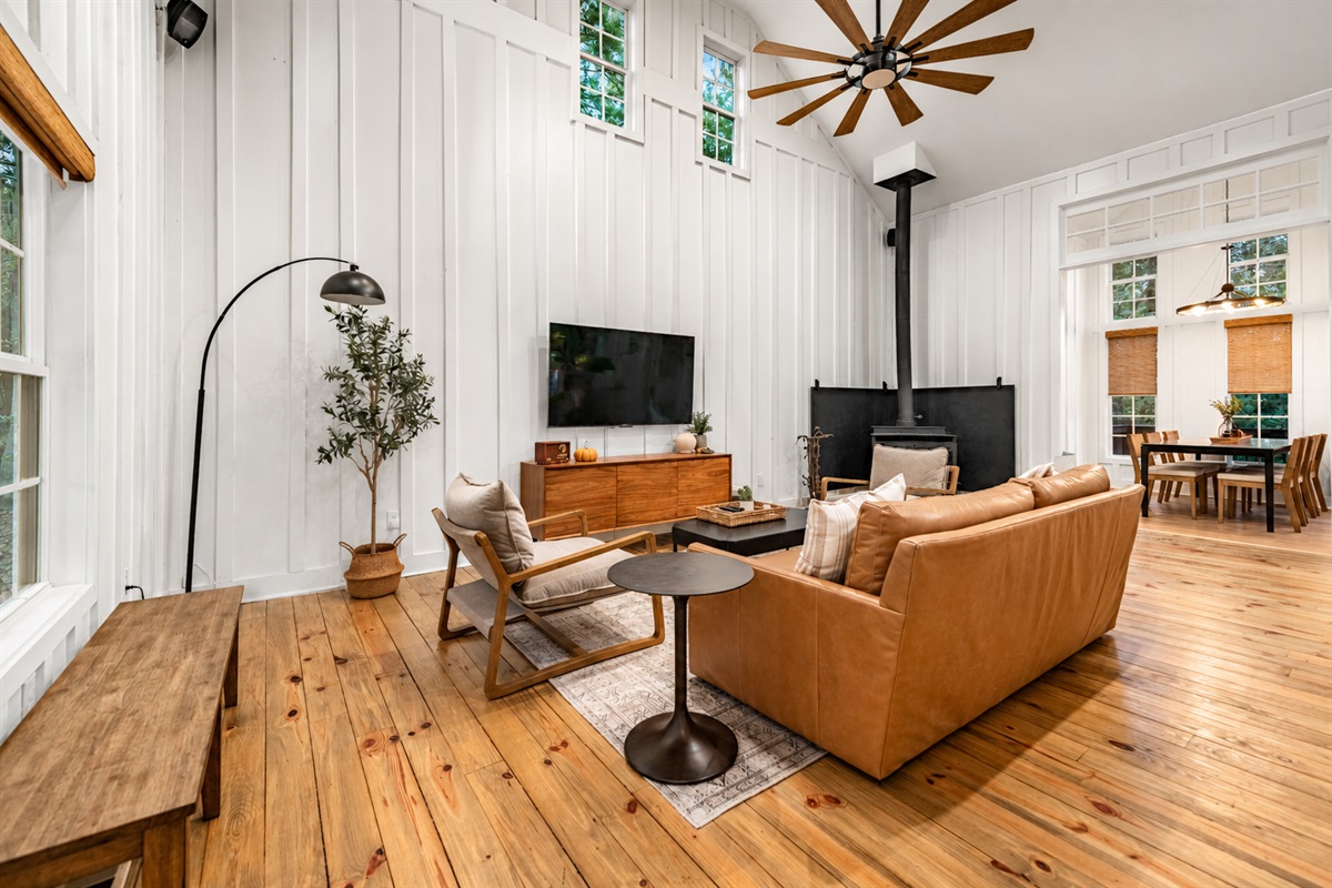The ceiling fan provides a cool, refreshing breeze, enhancing the comfort of the space.