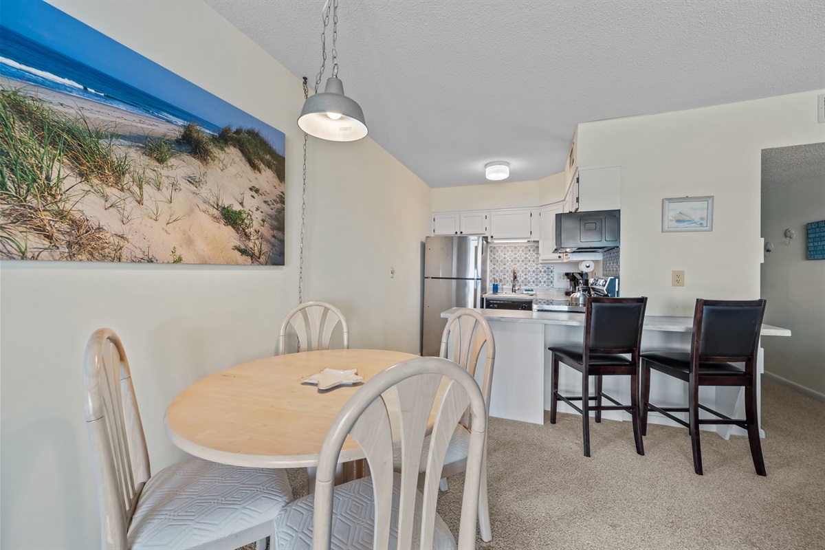 Casual dining nook paired with a breakfast bar&mdash;easy for quick bites or lingering conversations