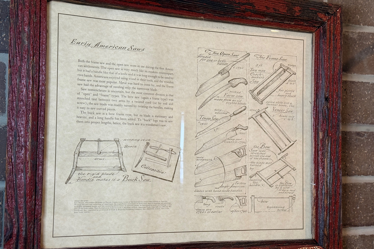 Framed mechanical artwork reinforces the studio’s industrial character.