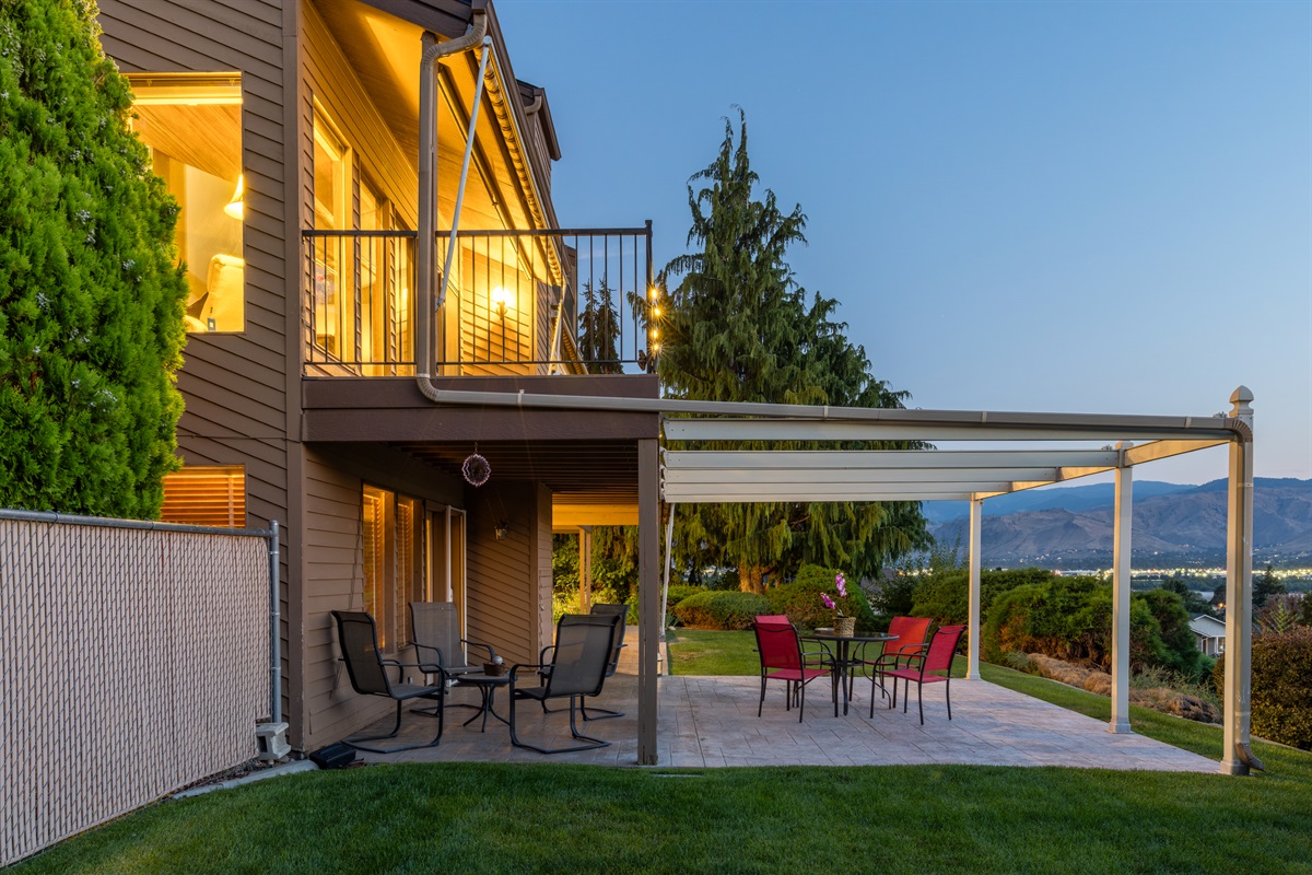 Large outdoor patio with dining space and valley views.