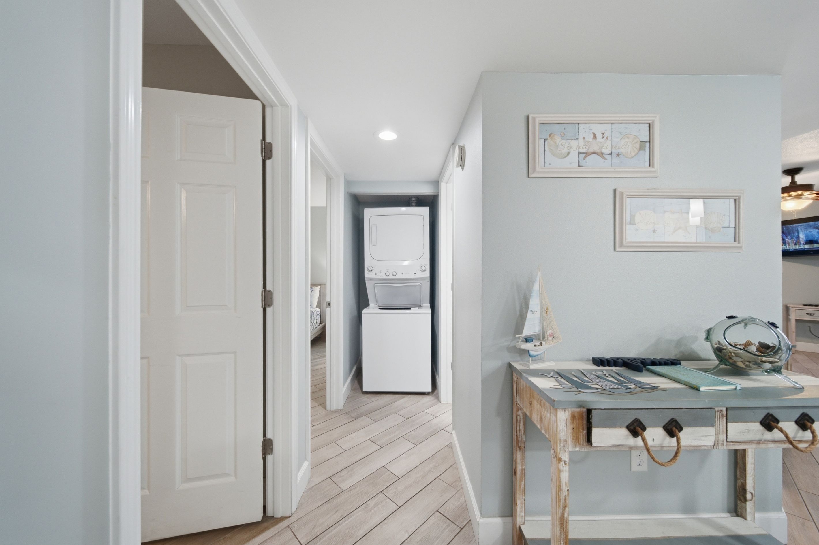 Entryway with coastal decor and extra pantry storage
