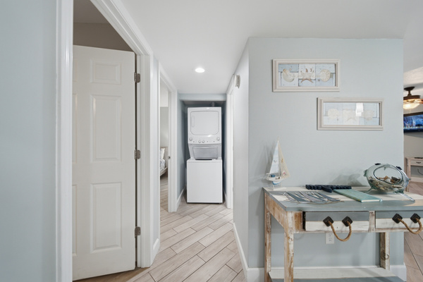 Entryway with coastal decor and extra pantry storage