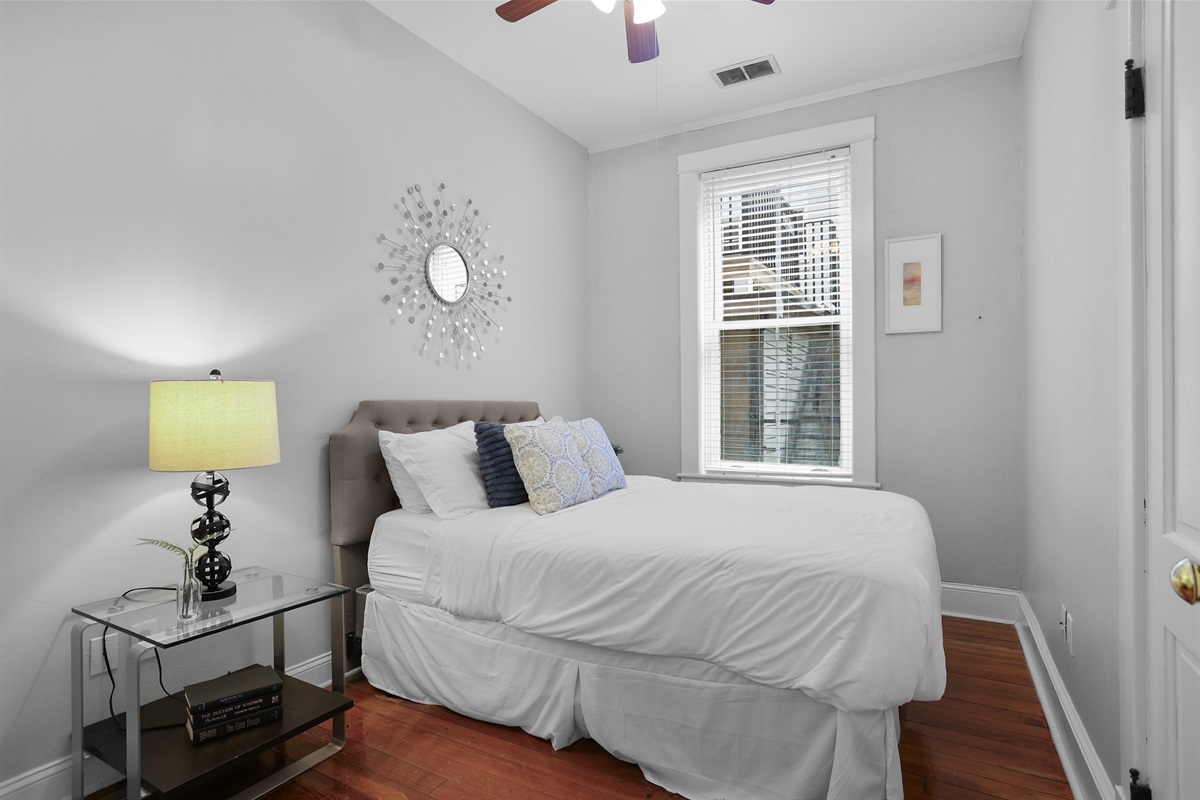 Cozy and sun-filled with plush bedding for a restful night.