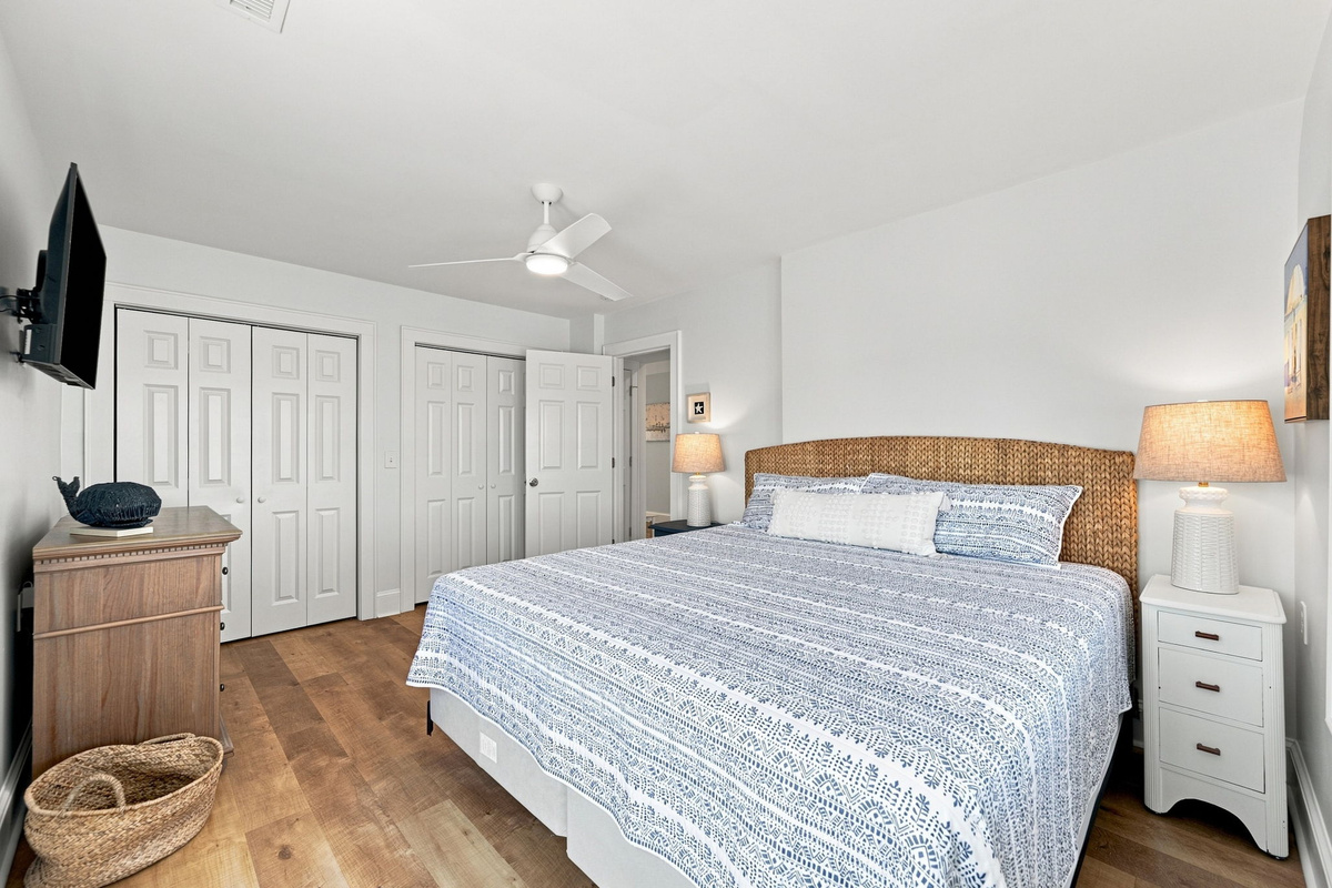 Relax in comfort with a plush king bed, Smart TV, ceiling fan, and ample closet space.
