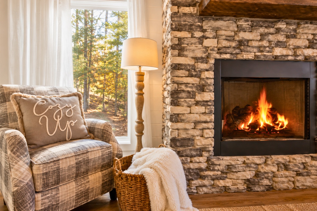 A warm fire, cozy seating, and thoughtful cabin touches make this inviting corner the perfect place to unwind with your favorite person.