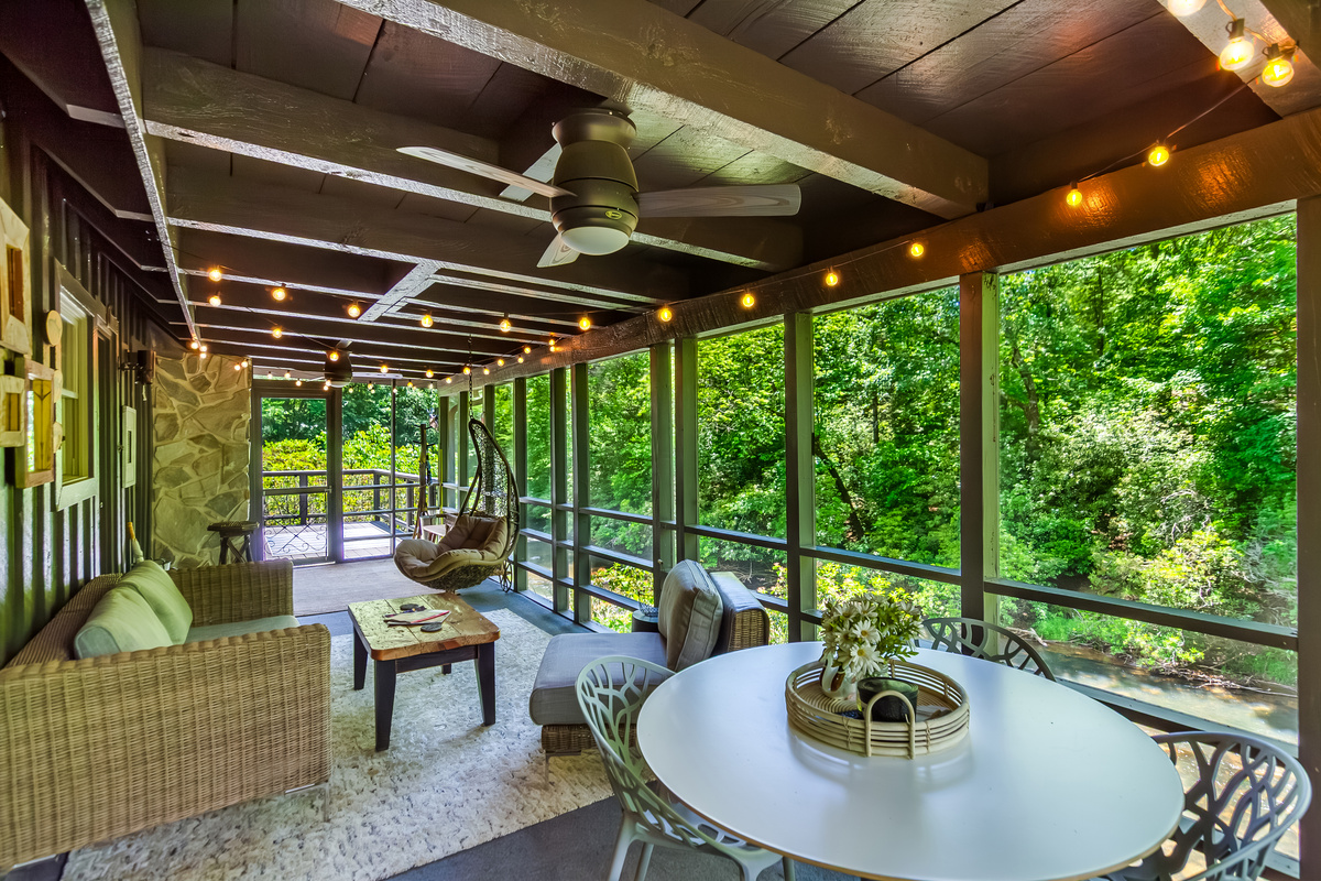 Ample seating and outdoor dining in the scree porch