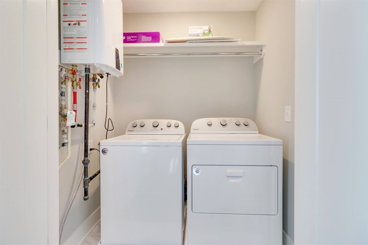 - Enjoy the convenience of in unit laundry with a full size washer and dryer - Overhead shelf keeps essentials neatly stored and within easy reach - Streamlined setup makes laundry day a breeze during your stay