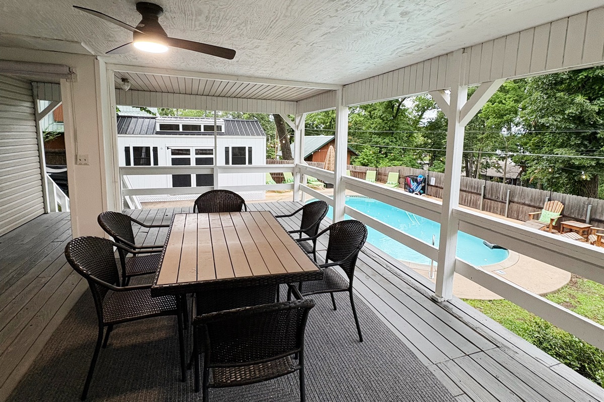 Covered Porch Overlooks the Beautiful Pool & Sundeck