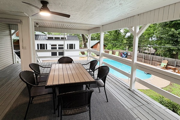 Covered Porch Overlooks the Beautiful Pool & Sundeck