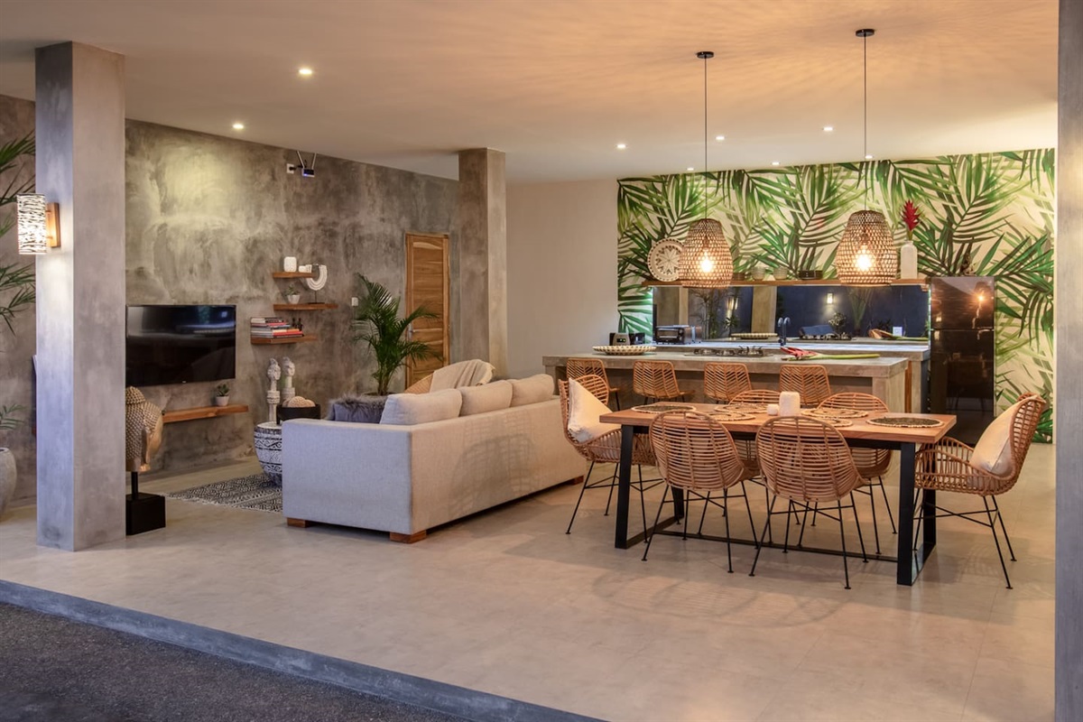 Living room, dining room and kitchen by night.