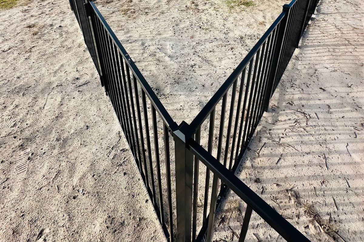 A private fenced dog run offers a safe space for your furry companions to play, soon to be freshly sodded for added comfort and convenience.