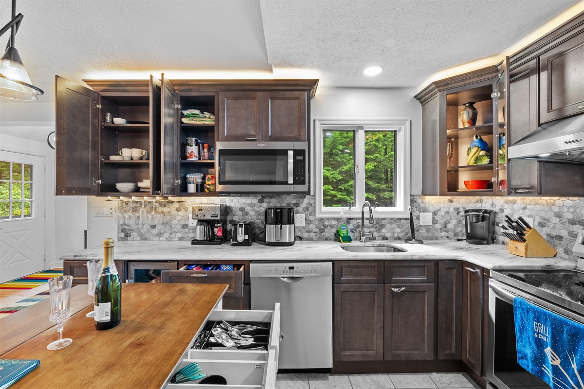 Cook with ease in this modern kitchen—includes full appliances and island counter