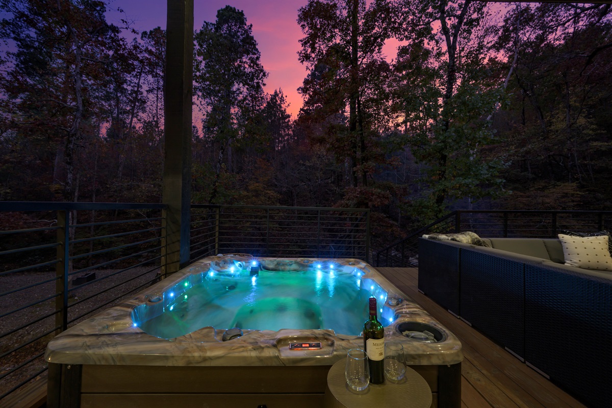 Evenings don’t get better than this—soak in the hot tub as the forest glows at sunset.