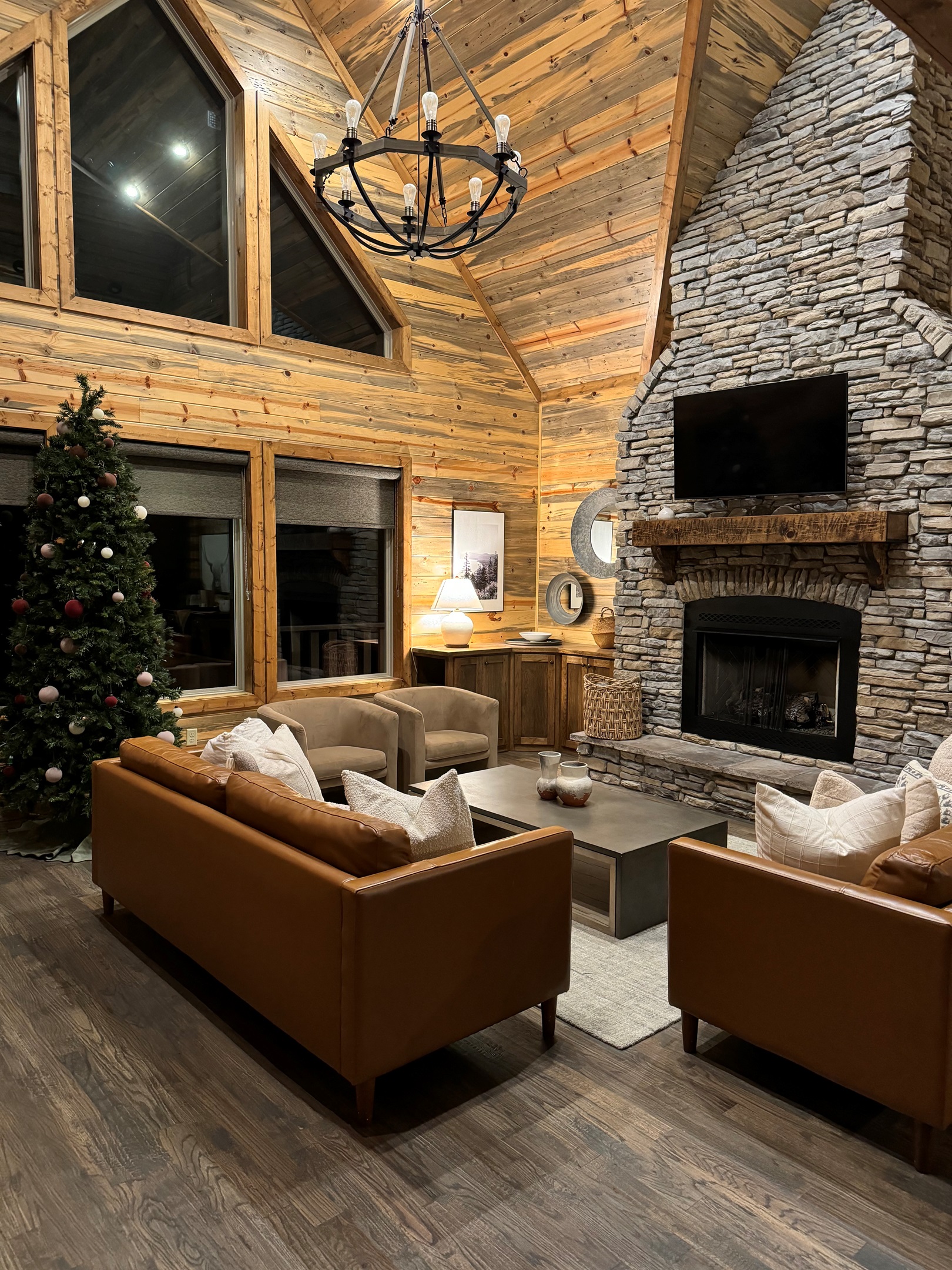 Warm wood interiors, stone fireplace, and soft natural light — your Hochatown cabin retreat starts here.