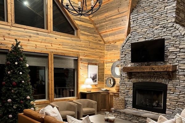 Warm wood interiors, stone fireplace, and soft natural light — your Hochatown cabin retreat starts here.