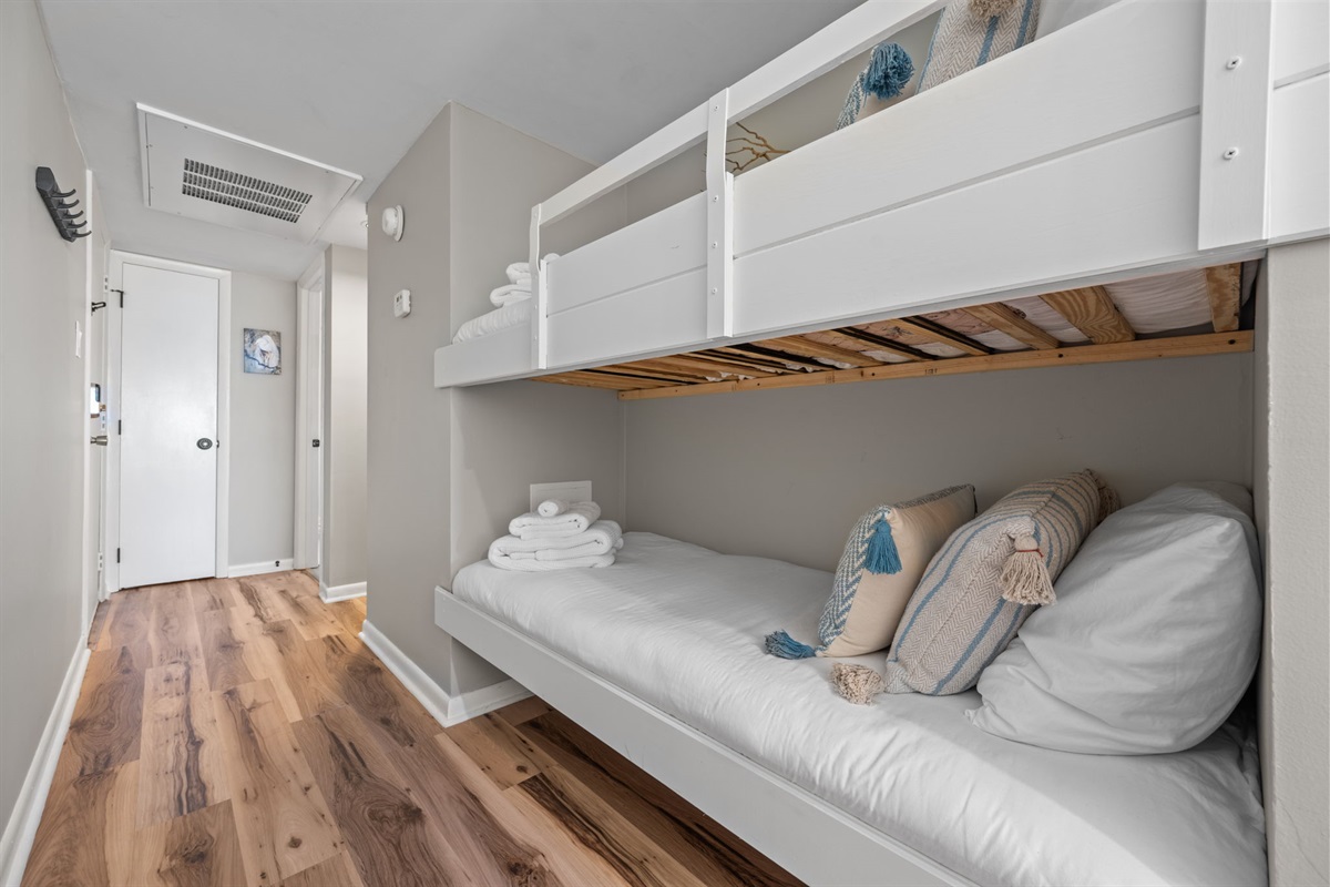 Cozy twin bunks tucked in the hallway&mdash;comfortable, functional, and space-saving