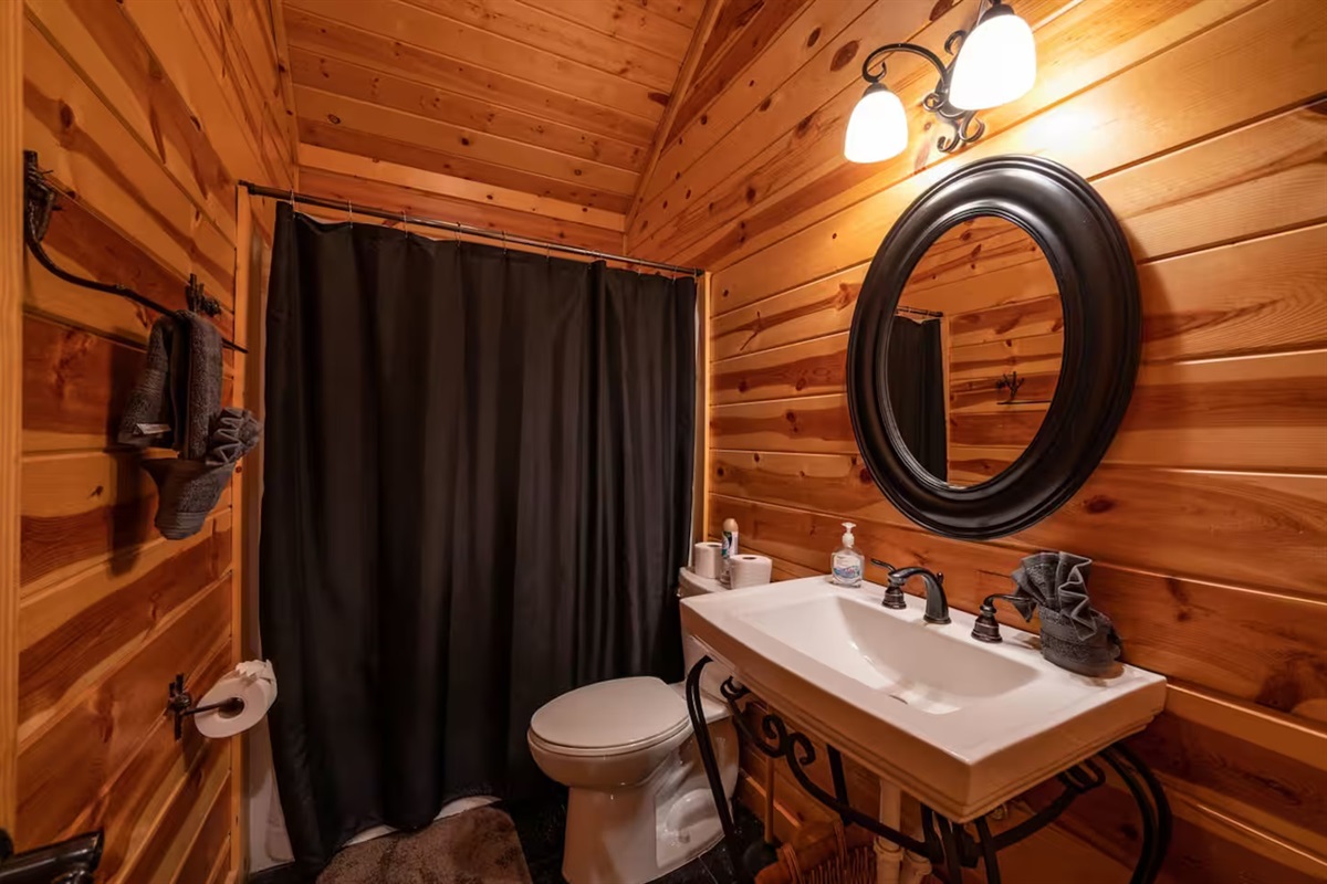 Natural textures meet refined finishes, creating a timeless balance between rustic charm and spa-like sophistication.