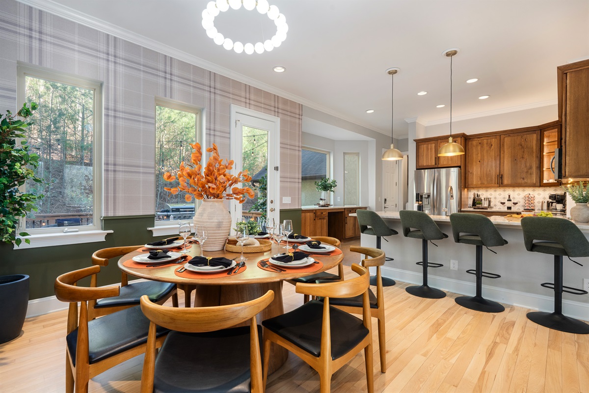 Open-concept kitchen and dining area - perfect for hosting group meals before heading out to explore Biltmore or downtown