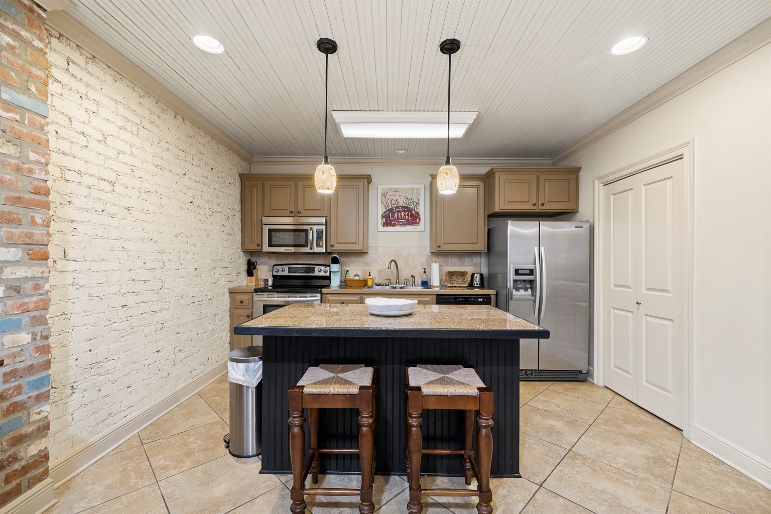 Cook and gather in the fully stocked kitchen with island seating