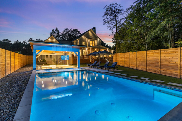 Pool and waterfall at night.